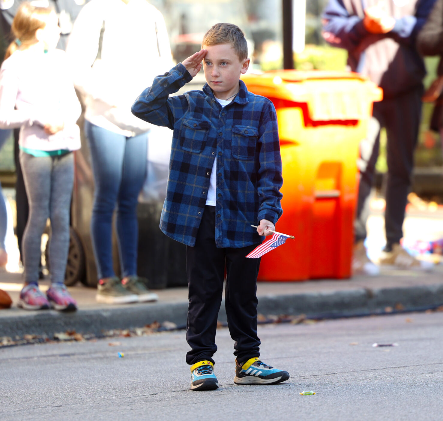 Boy salutes veterans during parade.JPG